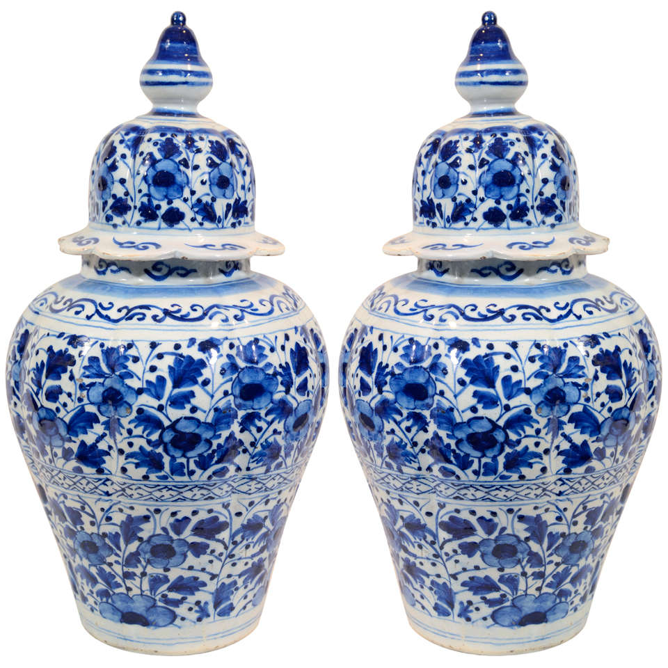 A Pair of Dutch Delft Blue and White Covered Vases