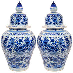 A Pair of Dutch Delft Blue and White Covered Vases