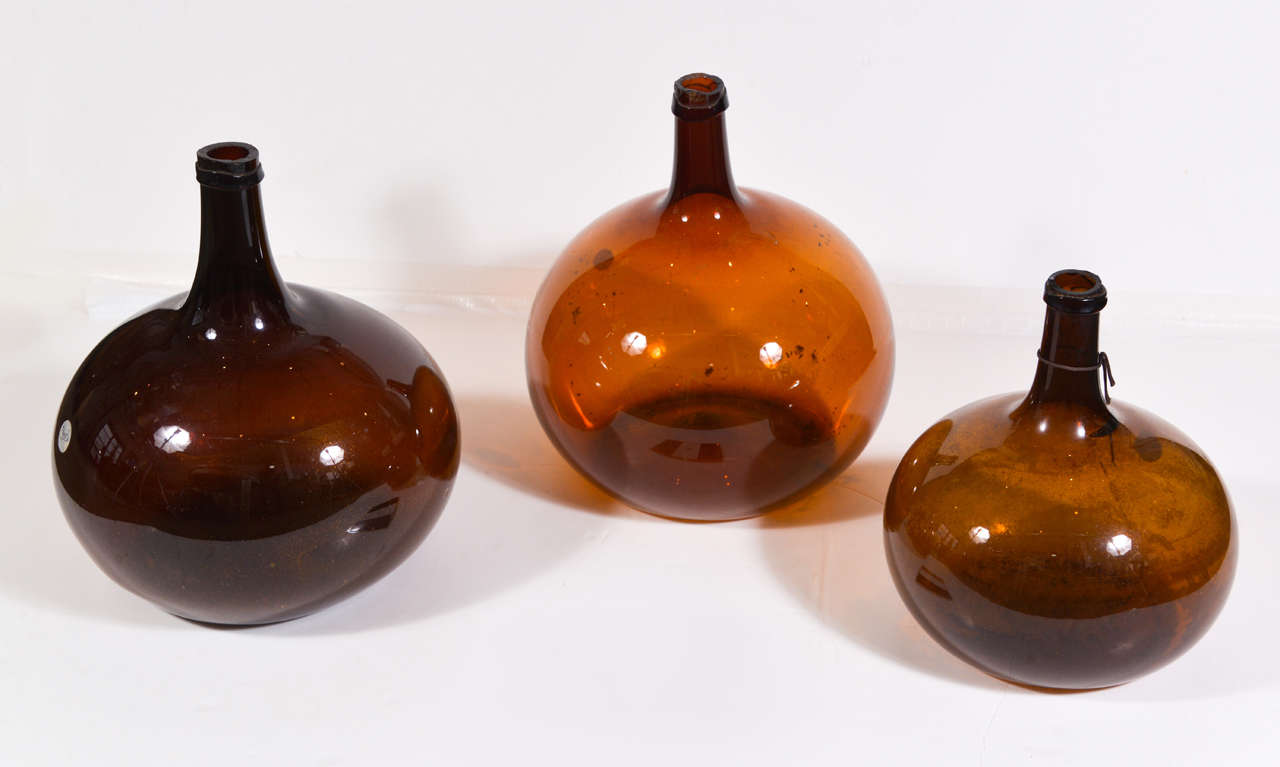 19th c. Hand Blown Amber Glass Wine Bottles from France. 