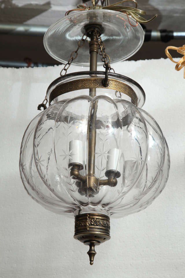 handblown glass antique belljar lantern with fern/star etchings and decorative brass knob in antique finish.Price includes wiring.