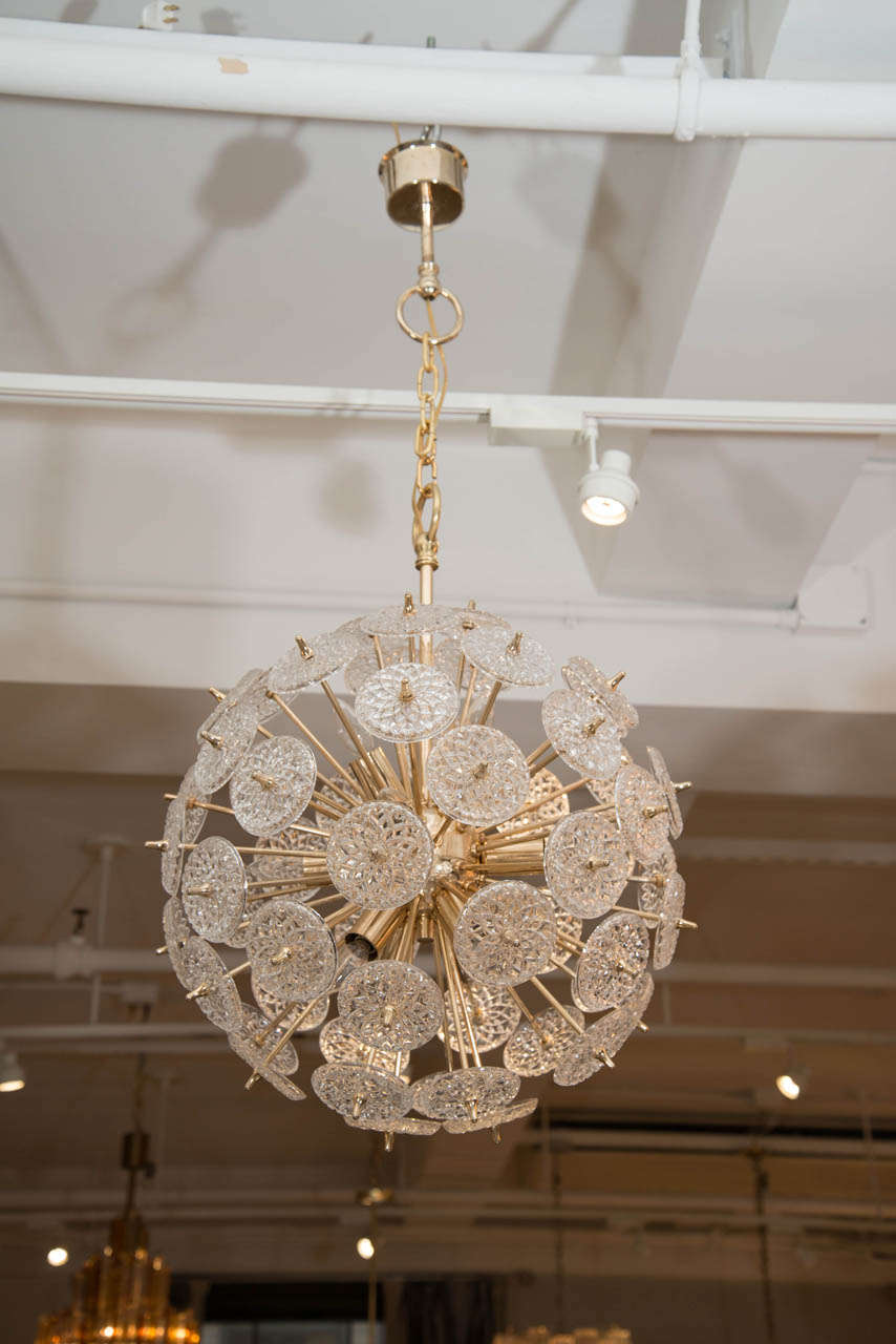 This dazzling duo, attributed to the Belgian glass manufacturer Val Saint Lambert, will bring star quality to any space.  Each lamp is composed of a brass 12-arm frame, surrounded by more than 50 cut glass 