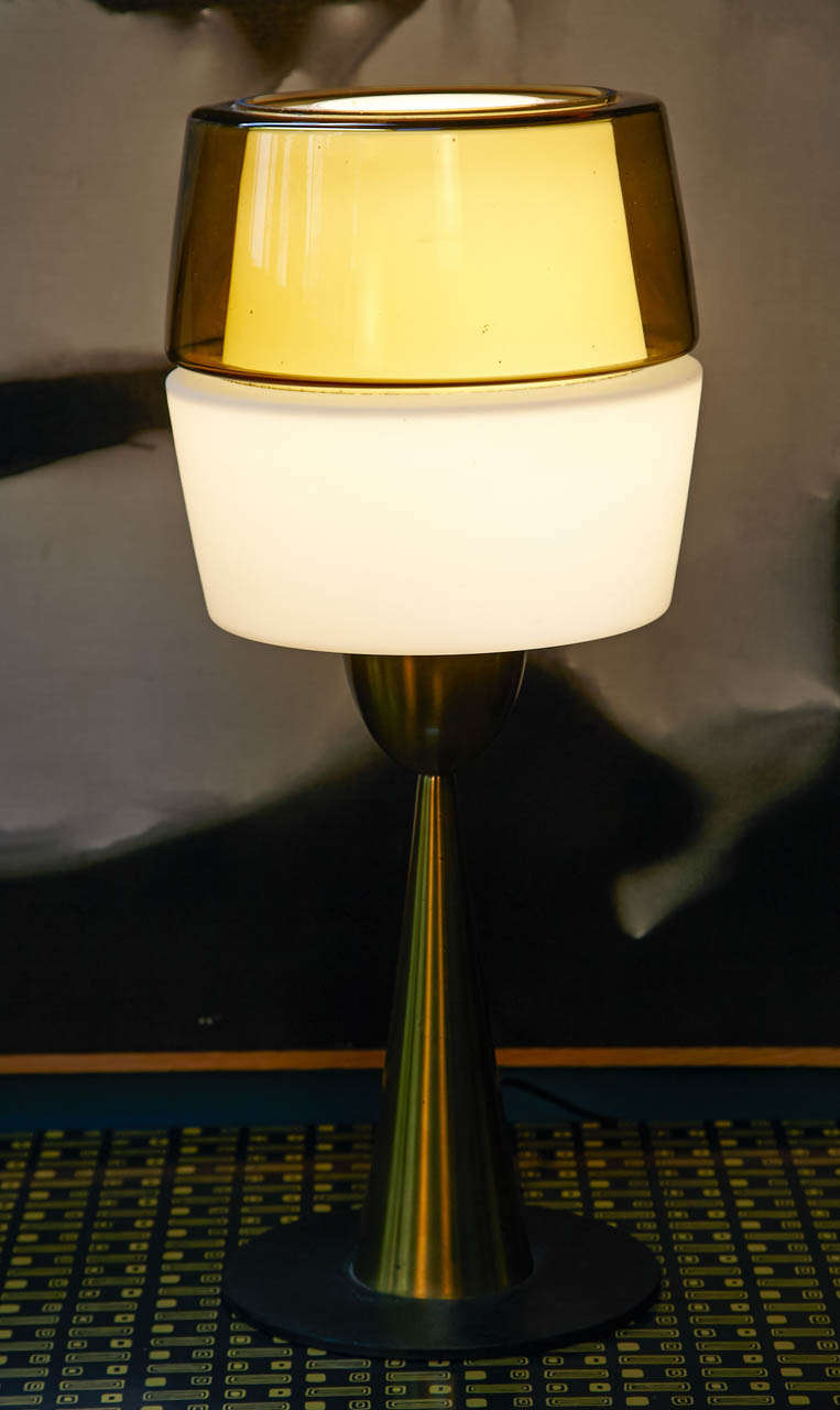 1960's Italian table lamp attributed to Arredoluce. Beautiful lighting for this entirely original opalin, glass  and solid brass. Beautiful patina and design. 
One of a kind.