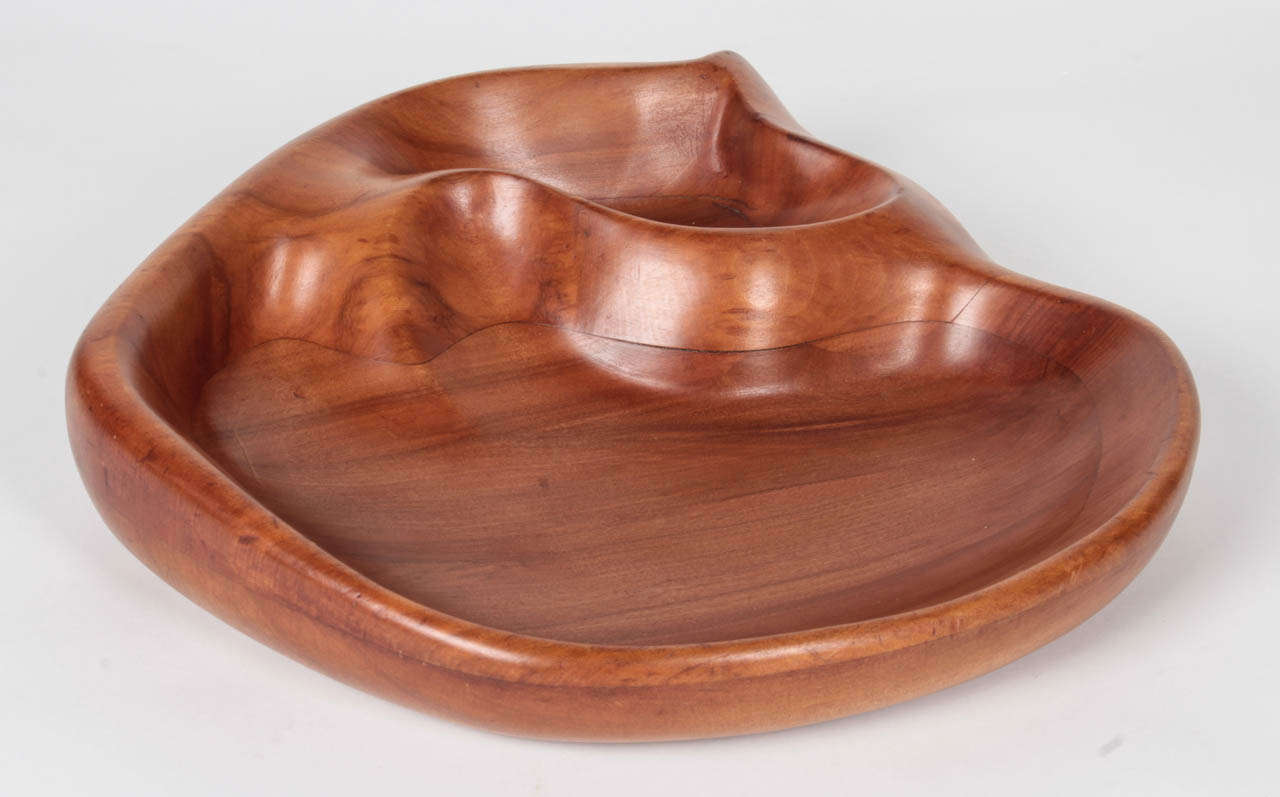 RUSSEL WRIGHT  (1904-1976)  USA
KLISE WOOD WORKING COMPANY  Grand Rapids, Mich.

Oceana bowl  c. 1935 

Hand carved walnut in a biomorphic ocean inspired shape 

Marks: Russel Wright (branded script signature on back)

Illustrated:  The