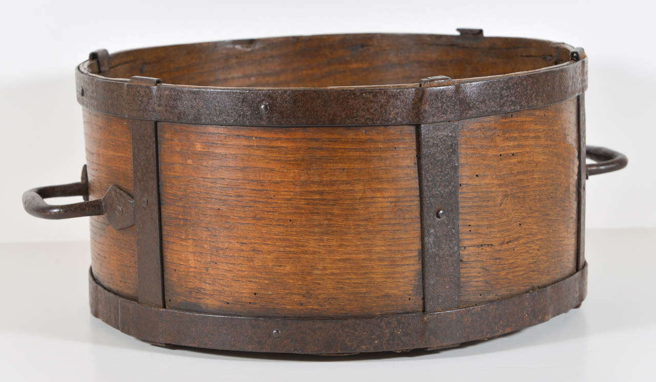 Oak and hand forged iron bin used for measuring grain. Has great handles.
