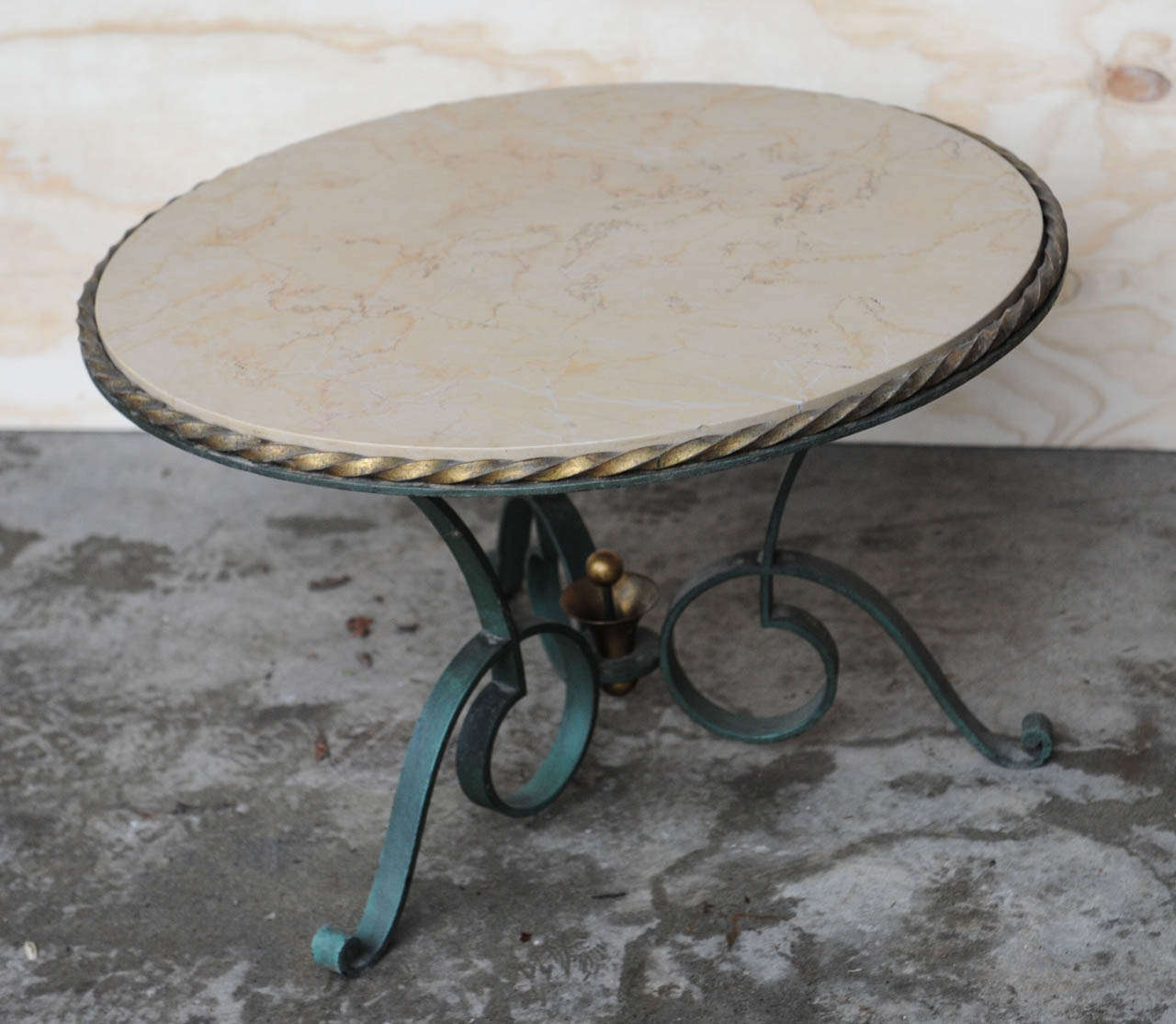 Round wrought iron coffee table with ivory coloured marble top.
French design, 1940's by Robert Merceris.