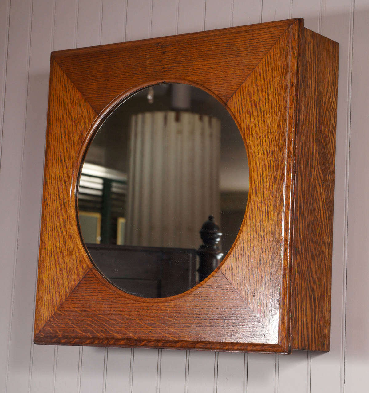 Medicine cabinet converted from 19th century oak clock case.  New glass shelves and mirror.  Magnetic latch.