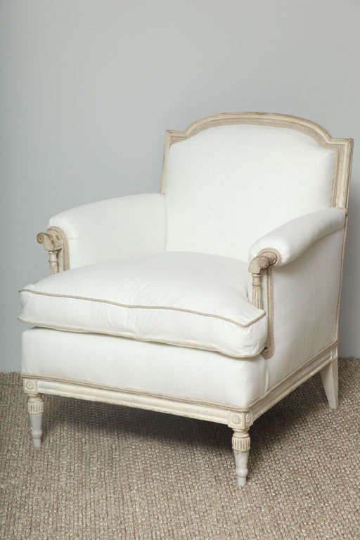 These sophisticated  Louis XVI Style upholstered arm chairs  with set back arms and curved backs (