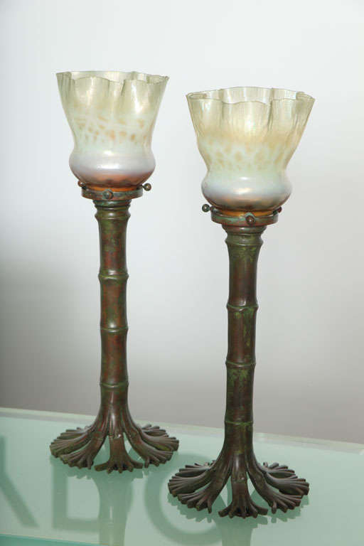 A pair of American Art Nouveau patinated bronze 