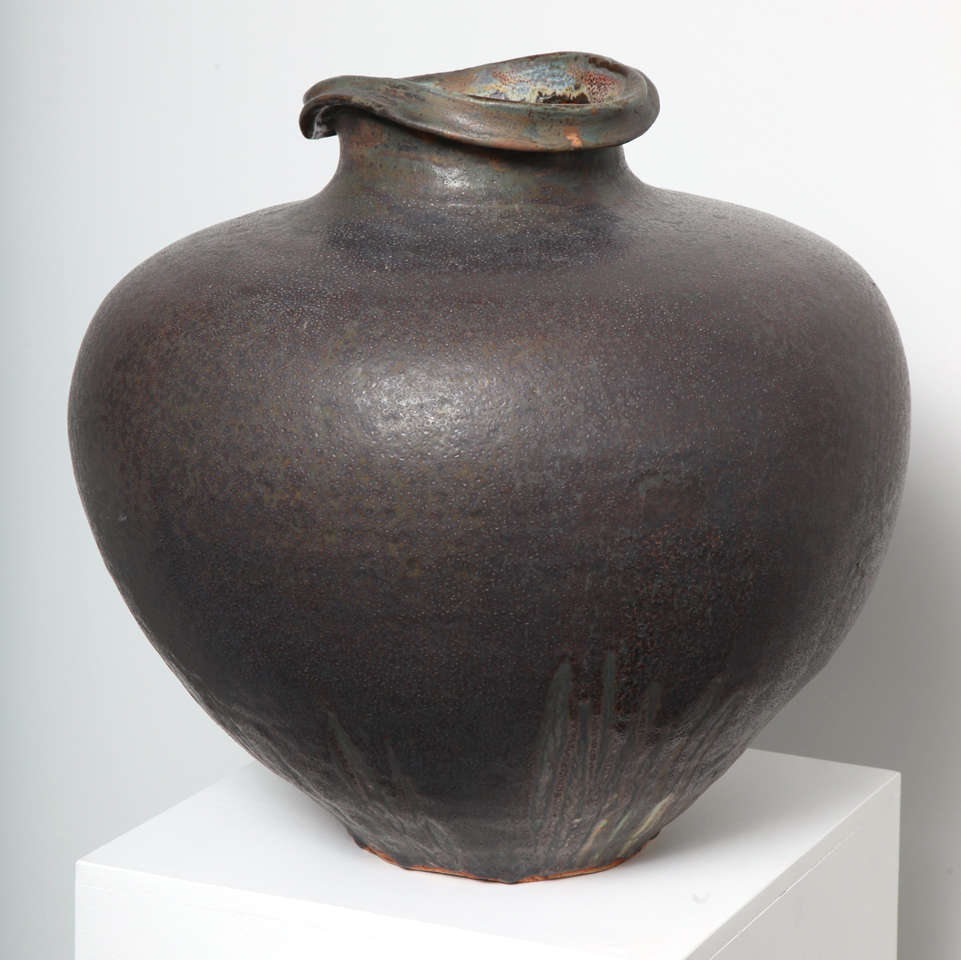 A large scale stoneware jar with soft speckled glaze with tones of pink and green. Of classic jar form with a asymmetric neck.

Paul Chaleff - American

Public Collection

Metropolitan Museum of Art
Museum of Modern Art
Museum of Fine