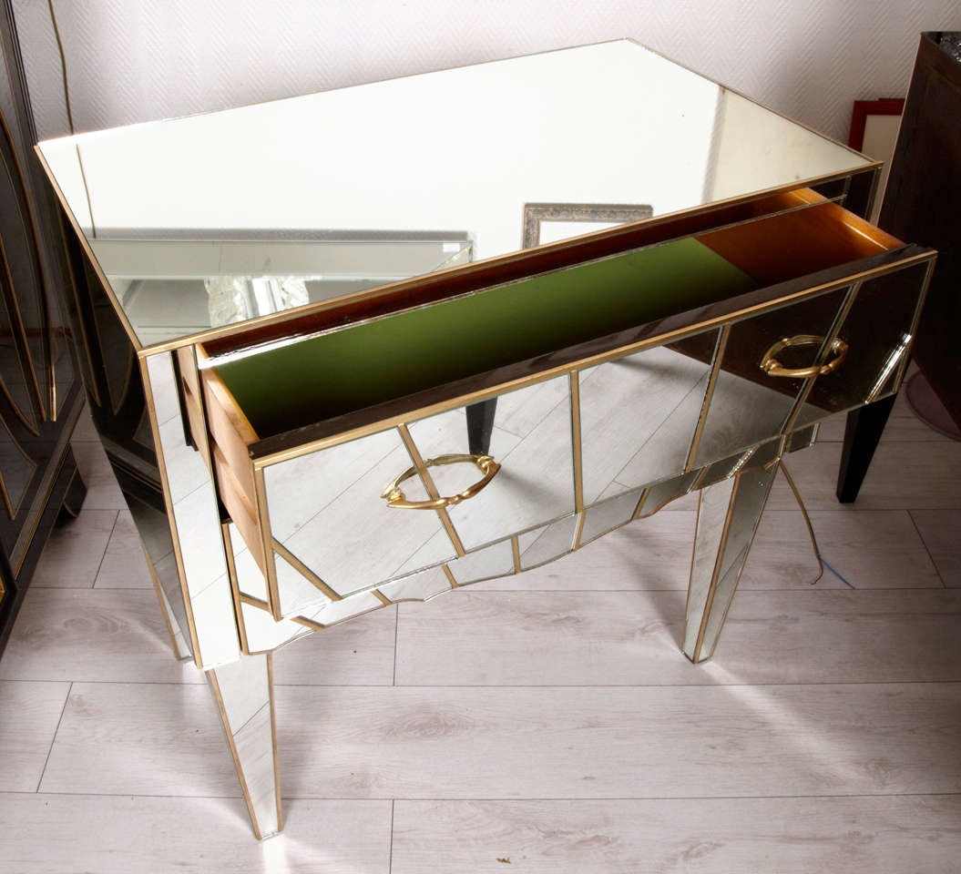 Pair of commodes in mirror.