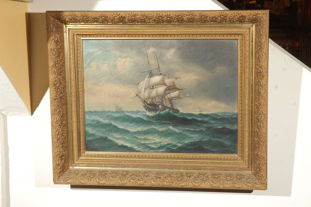 19th century American oil painting on canvas of a ship at sea. Signed (Illegible) with original gold finish wood and plaster frame.