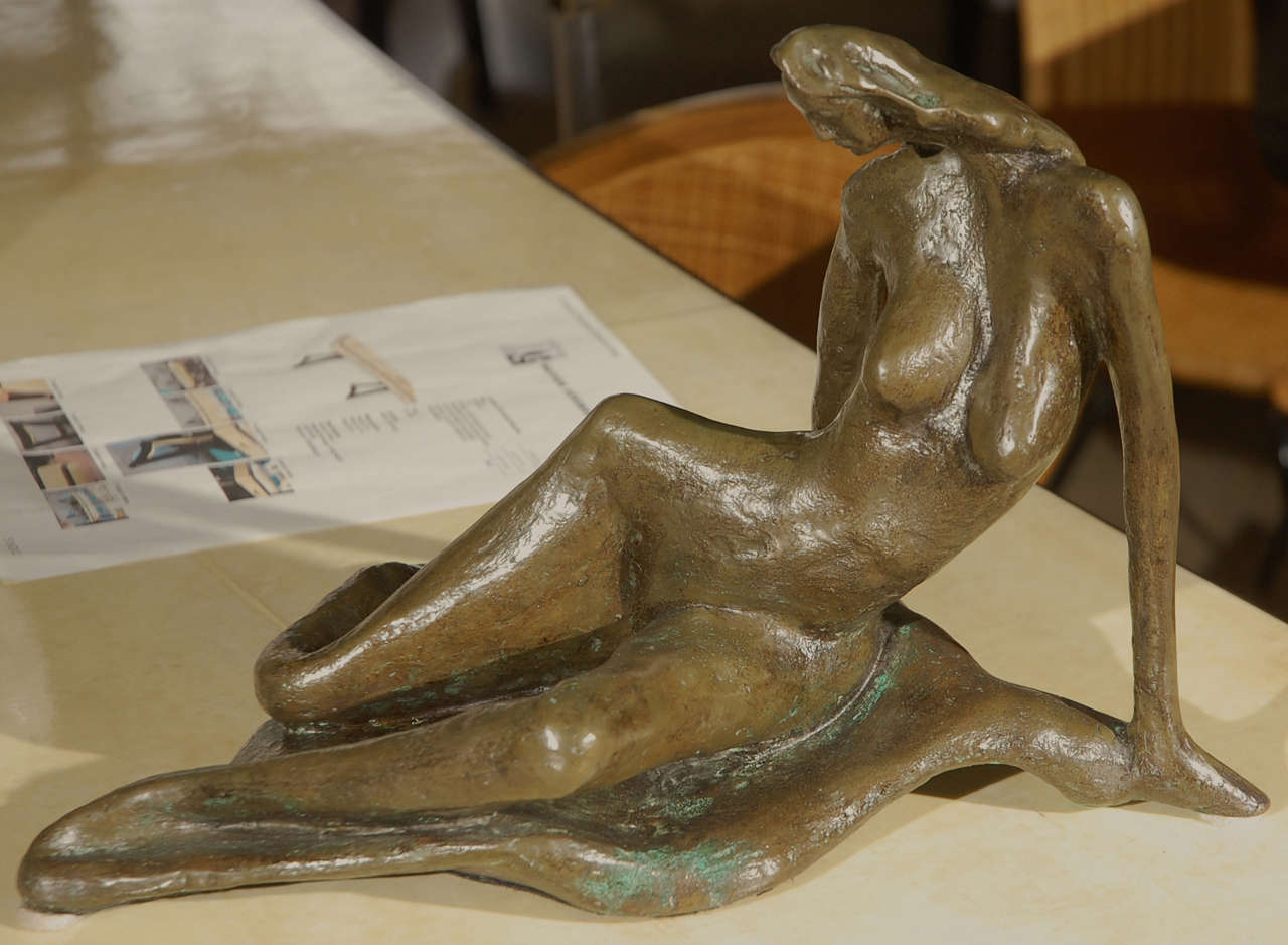Solid bronze woman sculpture signed by Holmes.