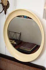 Oval resin mirror in bone/off-white finish, USA, circa 1960-1970.

Features a molded, deep frame. May be hung vertically or horizontally.