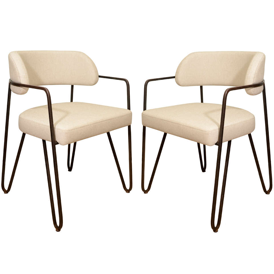 Fine side-chairs by Jacques Quinet in molded steel and leatherupholstered seat and back. Beautiful lines and brilliant construction.
8 pieces available, sold and priced as a pair.
