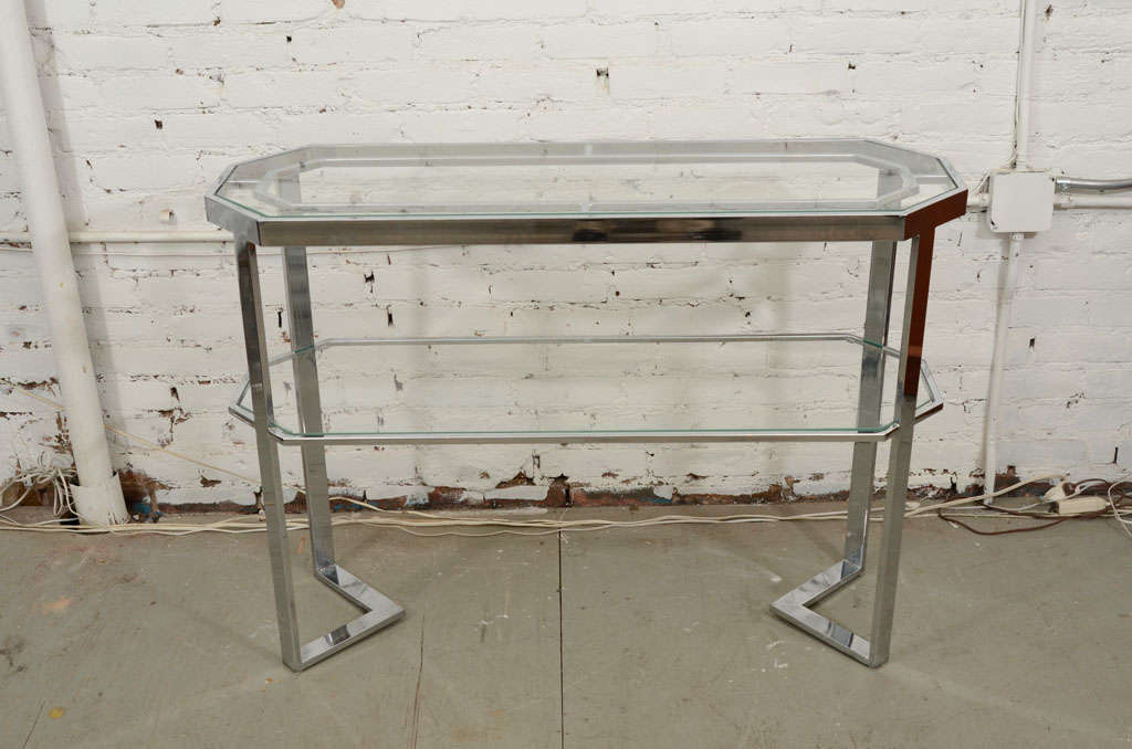 Striking angular console table with a chrome structure and glass inserts. Please contact for location. 