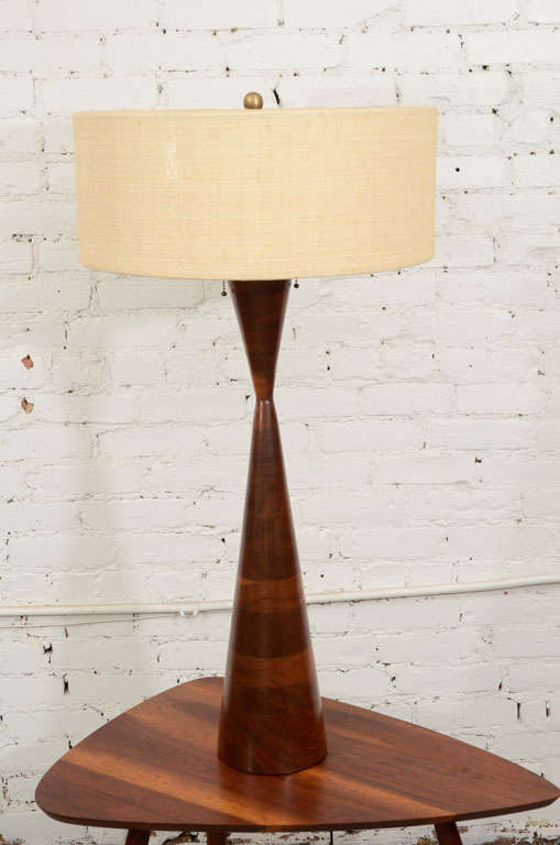 Impressive monumental lamp by Phillip Lloyd Powell.  Beautifully executed in black walnut and with original lamp shade.