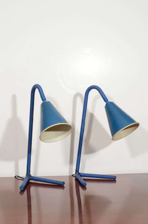 Pair of table lamps<br />
Tubular metal wrapped with original blue faux Malacca