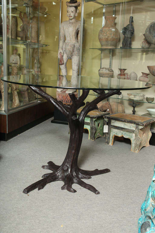 A bronze contemporary tree-trunk shaped dining table base from Thailand, capable of supporting a top up to 54