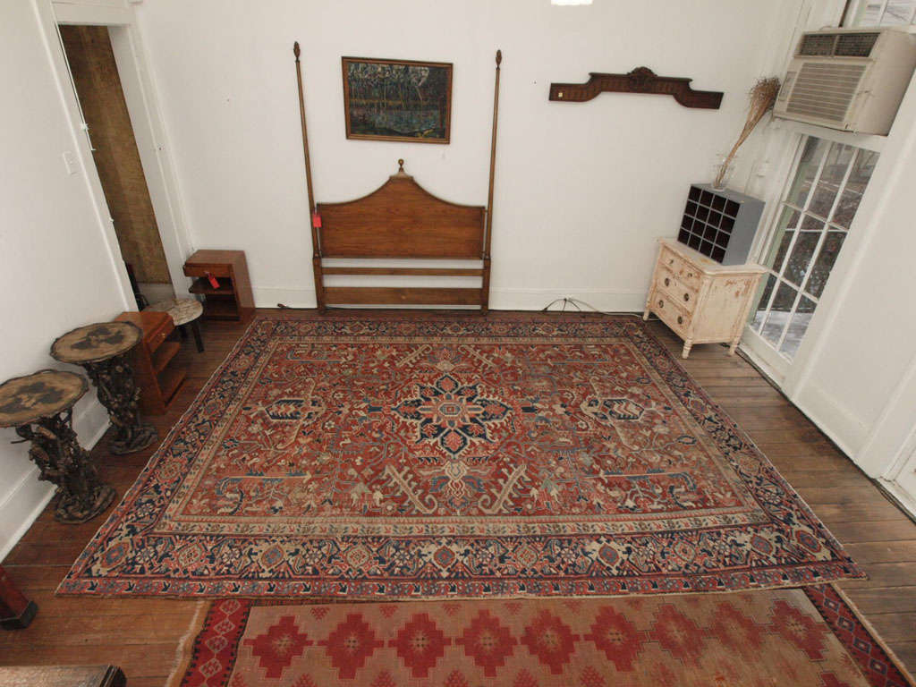 Heriz Serapi carpet has terracotta, blue, cream colors.