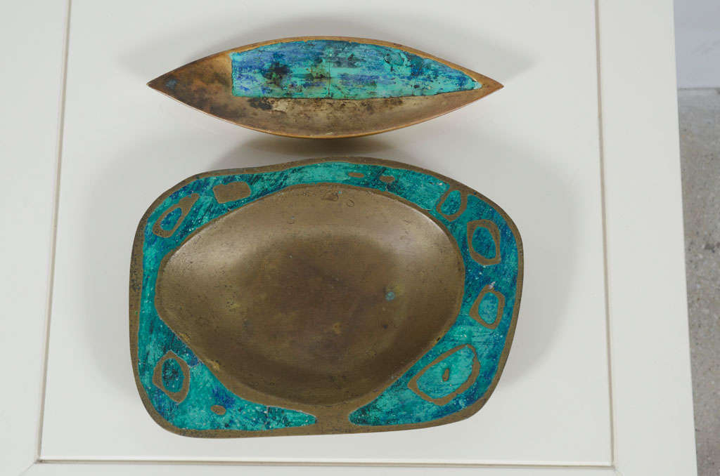 A wonderful set of accessory dishes includes two shallow brass trays each inlaid with turquoise colored ceramic. Each stamped by maker.  By Pepe Mendoza.  Mexican, circa 1950.<br />
Biomorphic Dish: 1