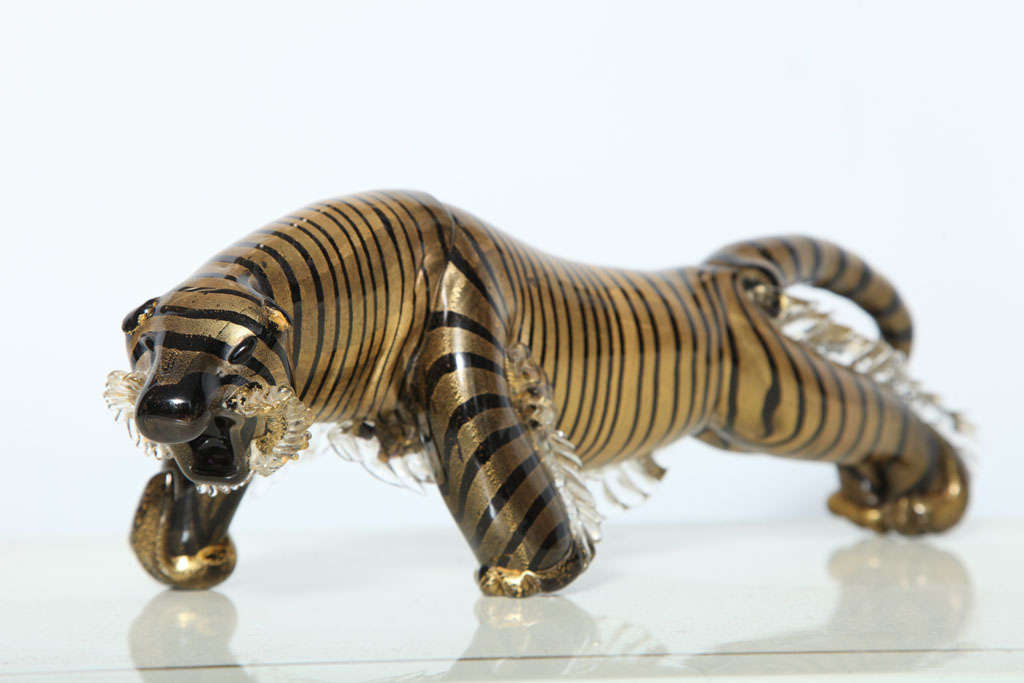 A vintage Cendese Murano glass tiger in gold and black with paper label