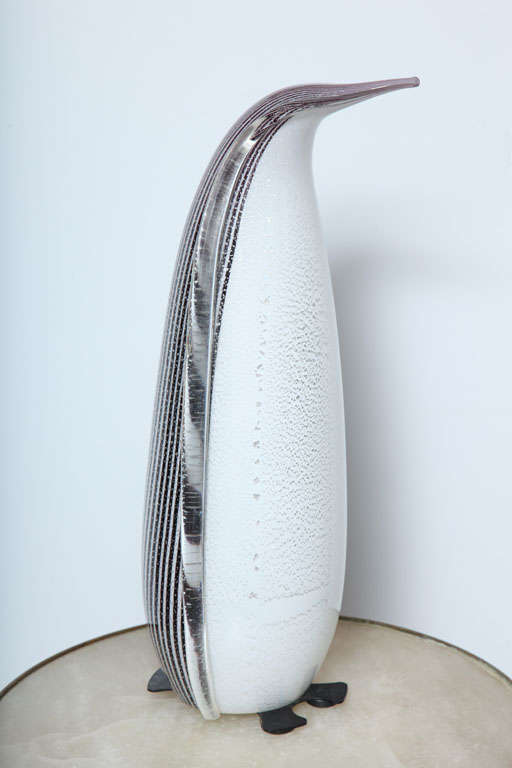 A penguin Murano glass lamp with striped back and gold flecks