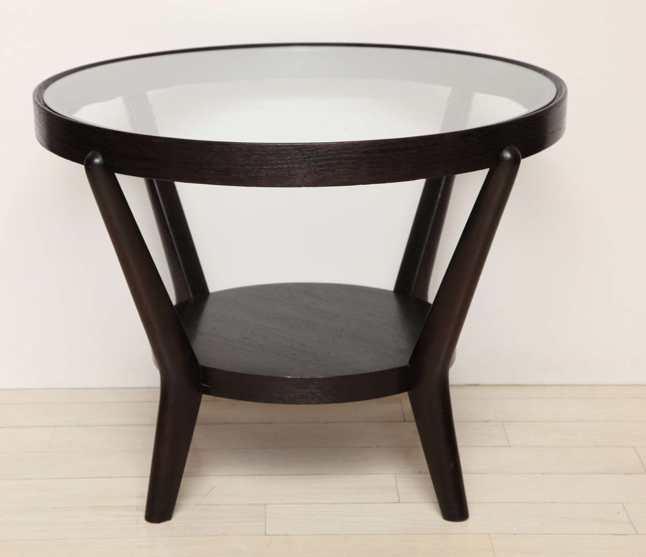 Pair of round oak two-tiered tables with glass tops by Halabala