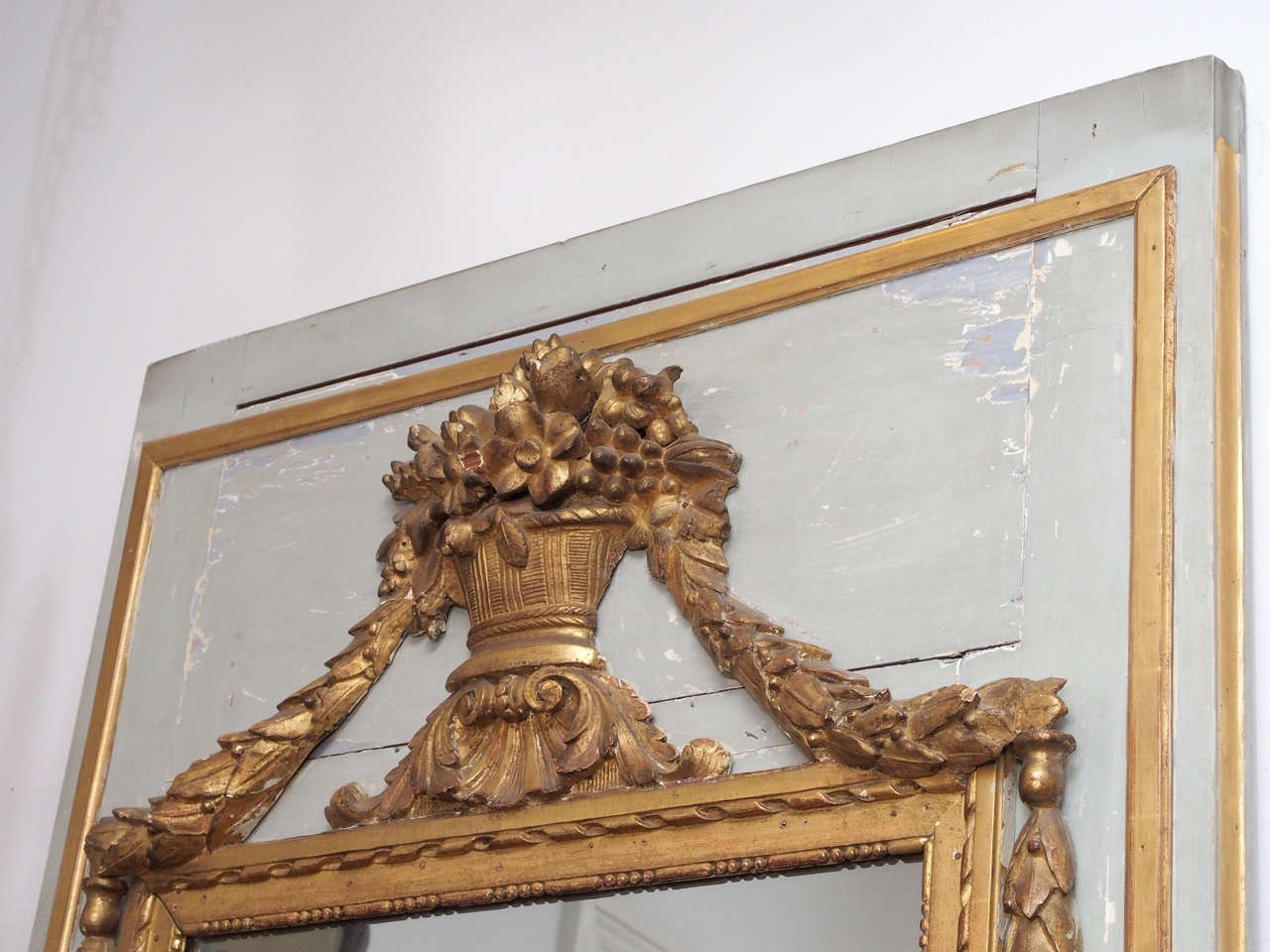 Neoclassical Tall Early 19th Century Louis XVI Style Mirror with an Urn and Garland Ropes For Sale