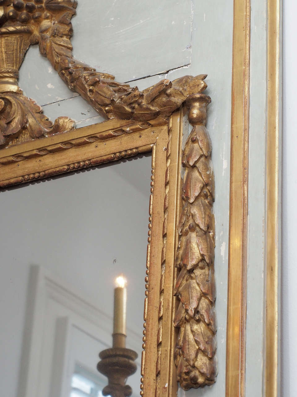 Gilt Tall Early 19th Century Louis XVI Style Mirror with an Urn and Garland Ropes For Sale