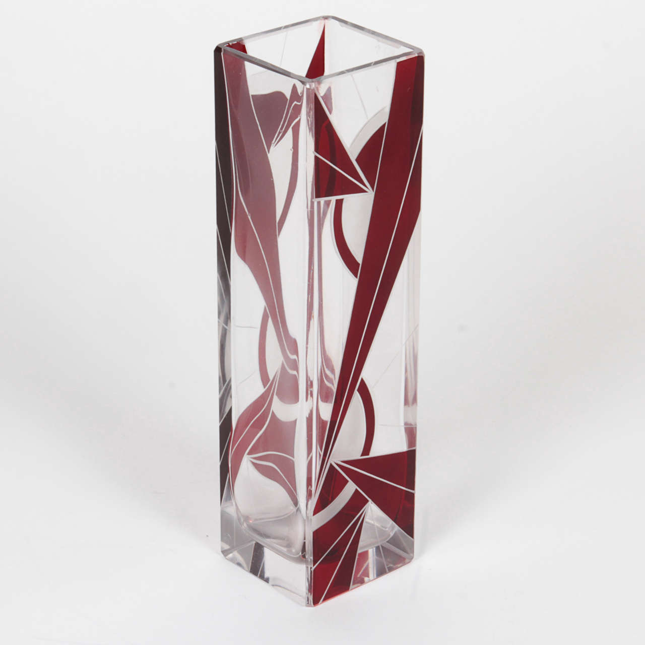 Vintage Art Deco Czech red and clear vase. The modern glass geometry is striking in contrast to the bold red pattern.