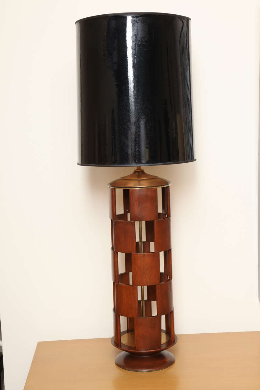 Wooden checkerboard lamp with brass fittings, circa 1960.