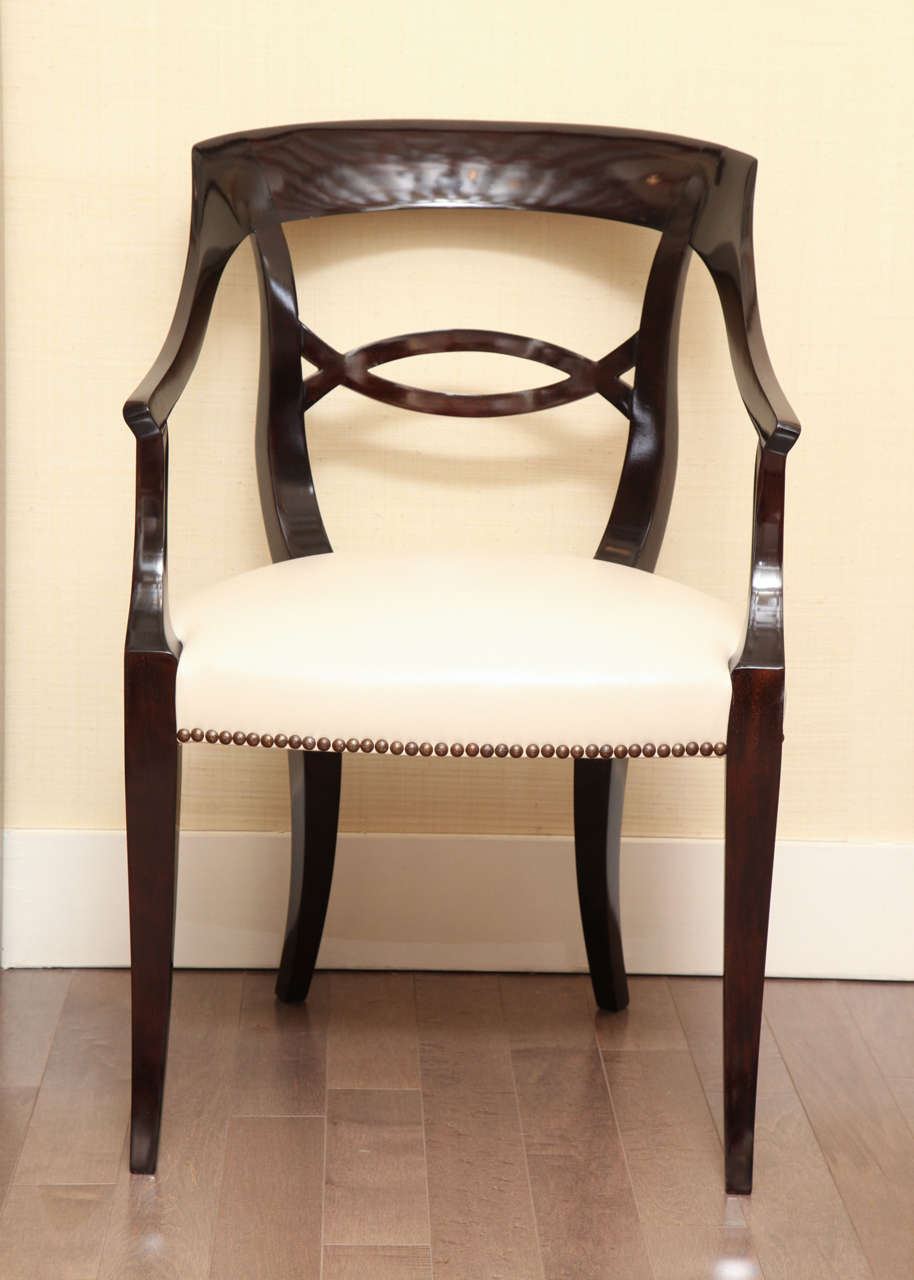 Lacquered mahogany Art Deco side chair newly upholstered in cream leather with nailhead treatment, circa 1940.