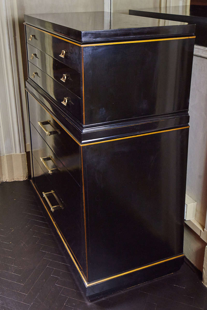 Slightly pyramidal shape, six drawers, three with dividers, gold leaves profiles, brass details.