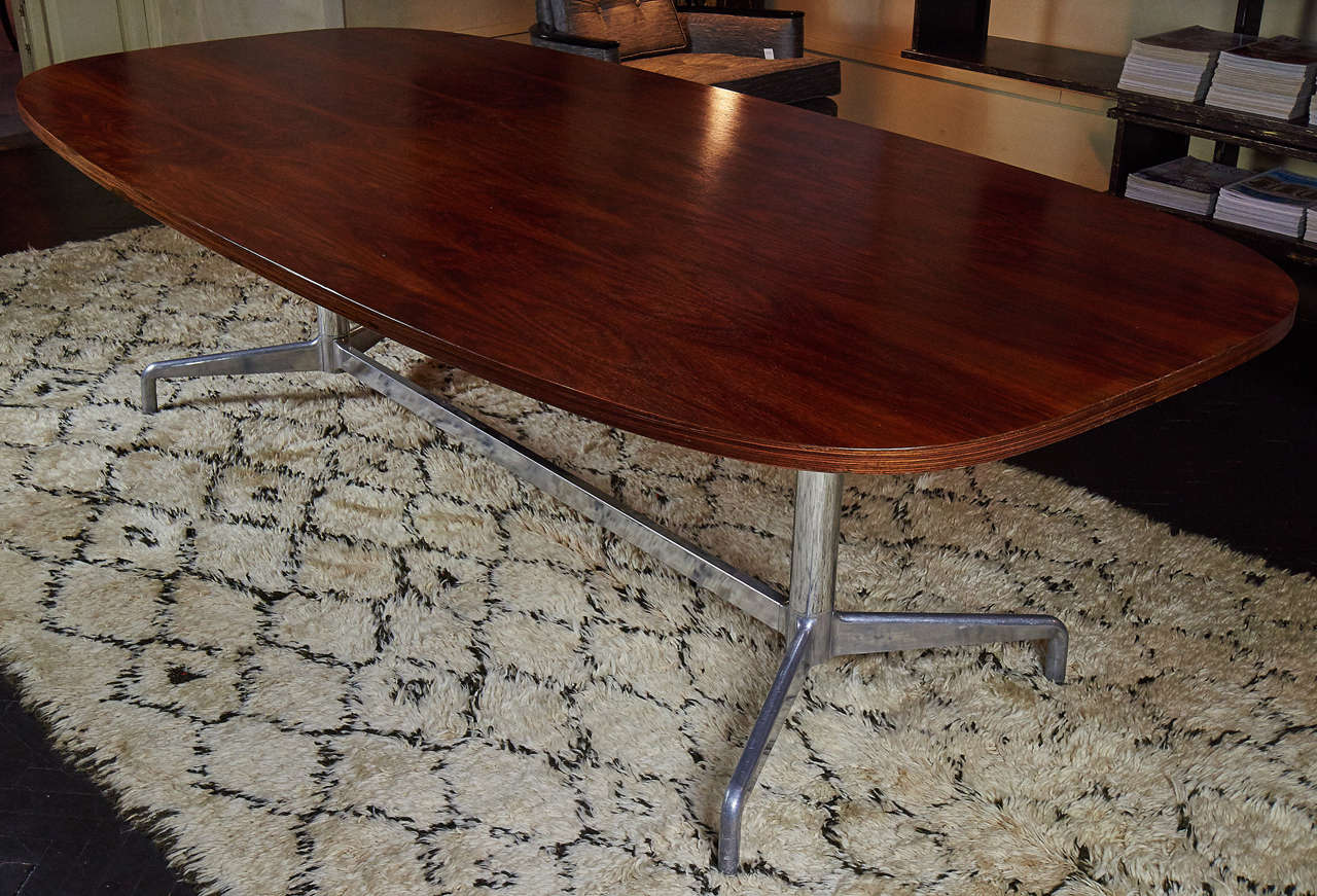 1970s Eames conference or dining table with rosewood top, aluminum base.