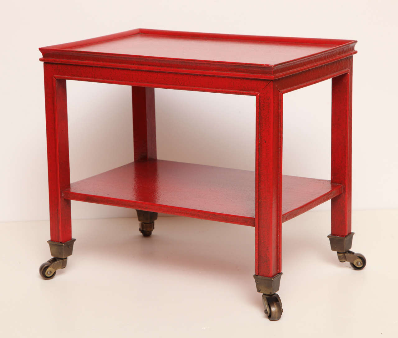 A telephone table by Jansen with a red faux-painted finish.