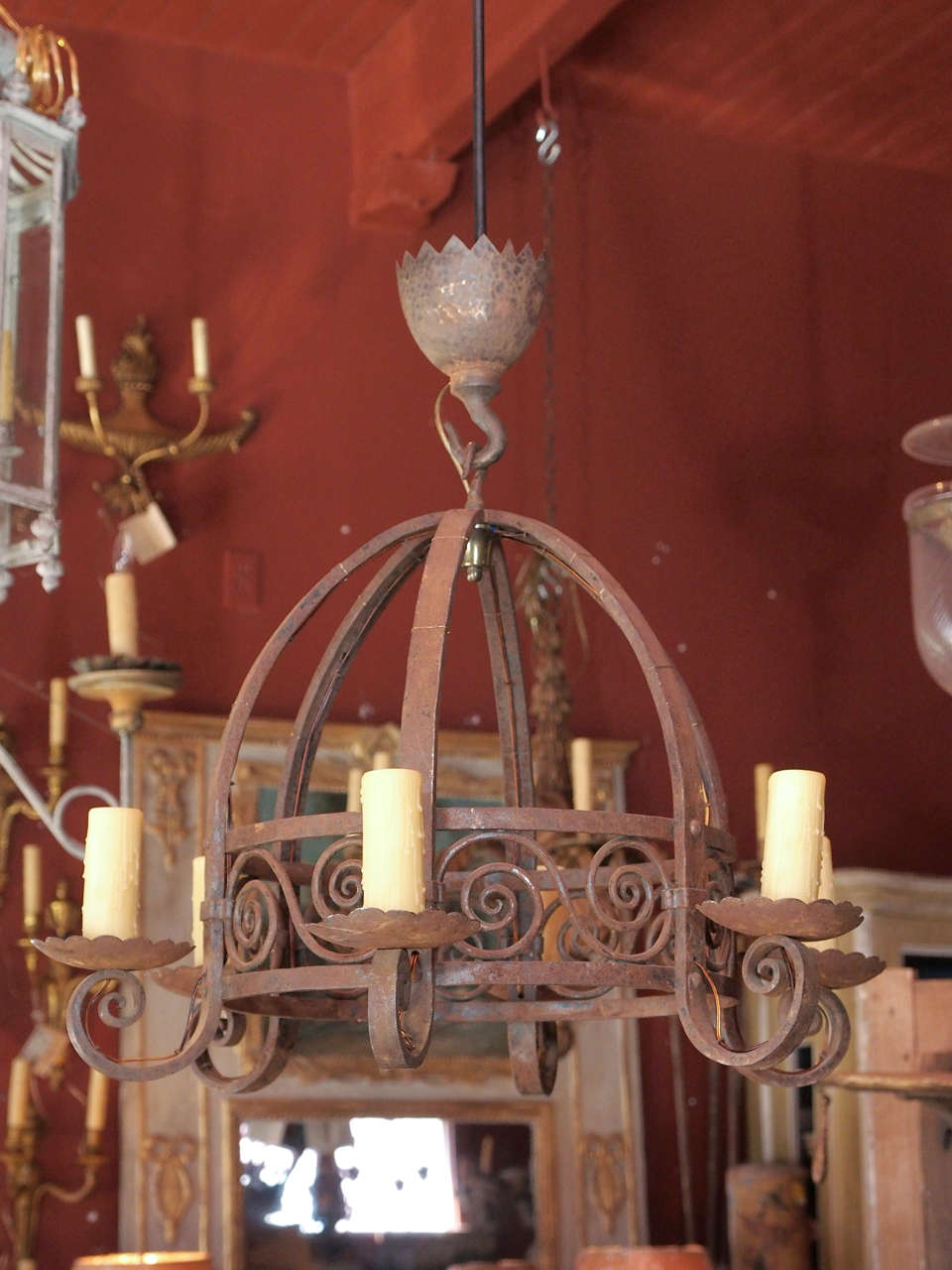 A 6 light dome wrought iron chandelier with matching ceiling cap. This
chandelier is extremely heavy.
