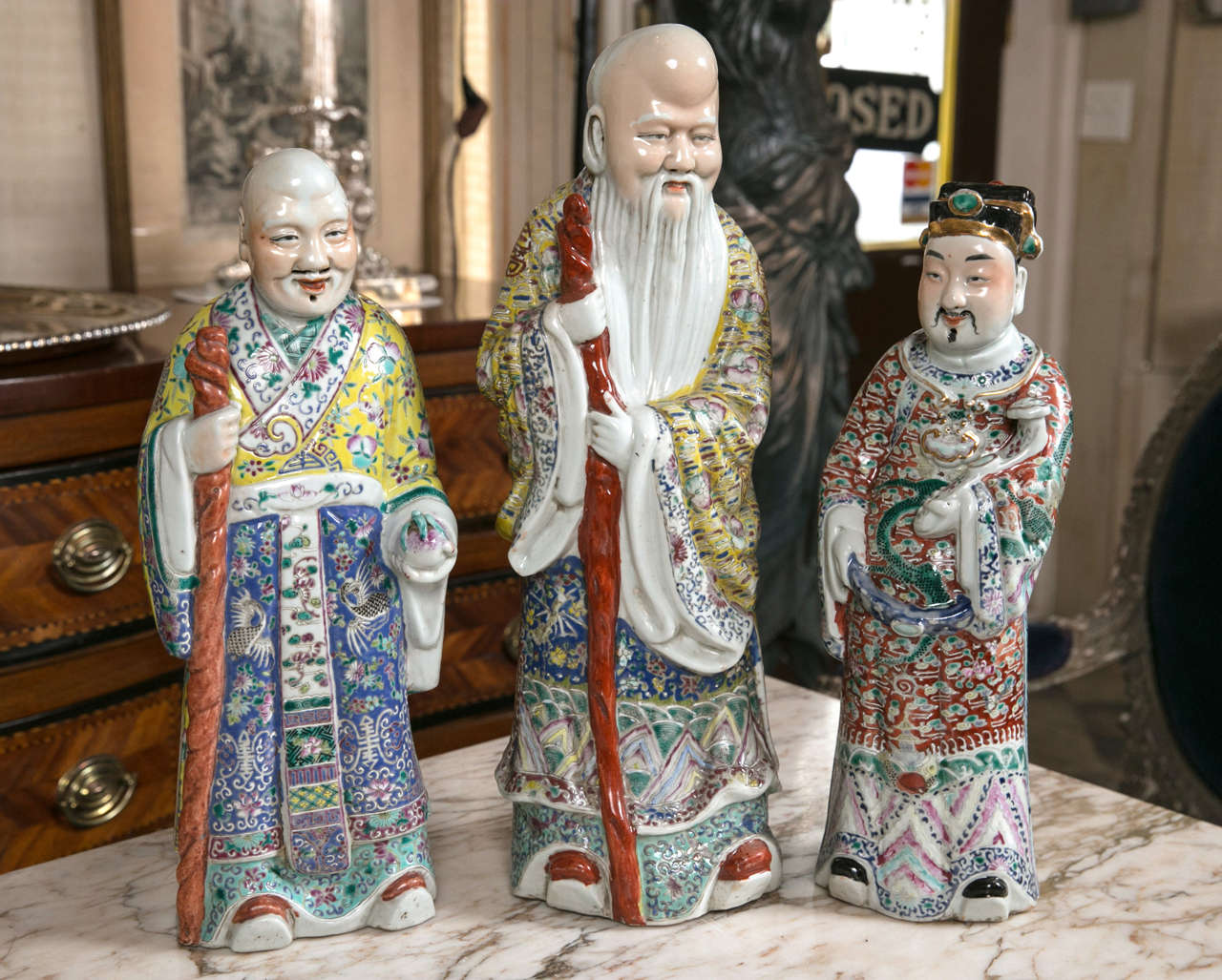 This group of three Chinese immortals consists of Loo, Foo and Sho. The smallest is 16.5 inches, the tallest 19.25 inches. Each has its own custom-made wooden base. They range in depth from 4.75 inches to 5.5 inches. They are all in excellent