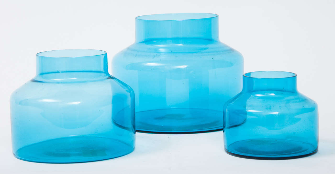 Set of three (3) blue glass jars / vases by Raymor.  Signed with paper label on largest piece.  Italy, circa 1960.  

Dimensions:
Largest: 7 inches W x 5 inches H