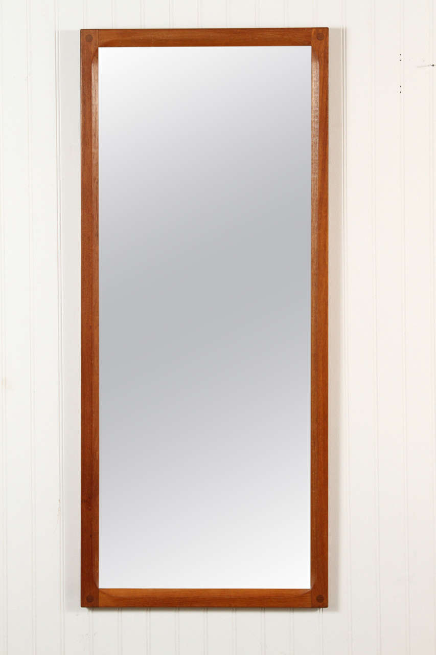 Teak framed mirror by Aksel Kjersgaard with exposed dowel joints and chamfered edges. Made in Denmark circa 1960s.