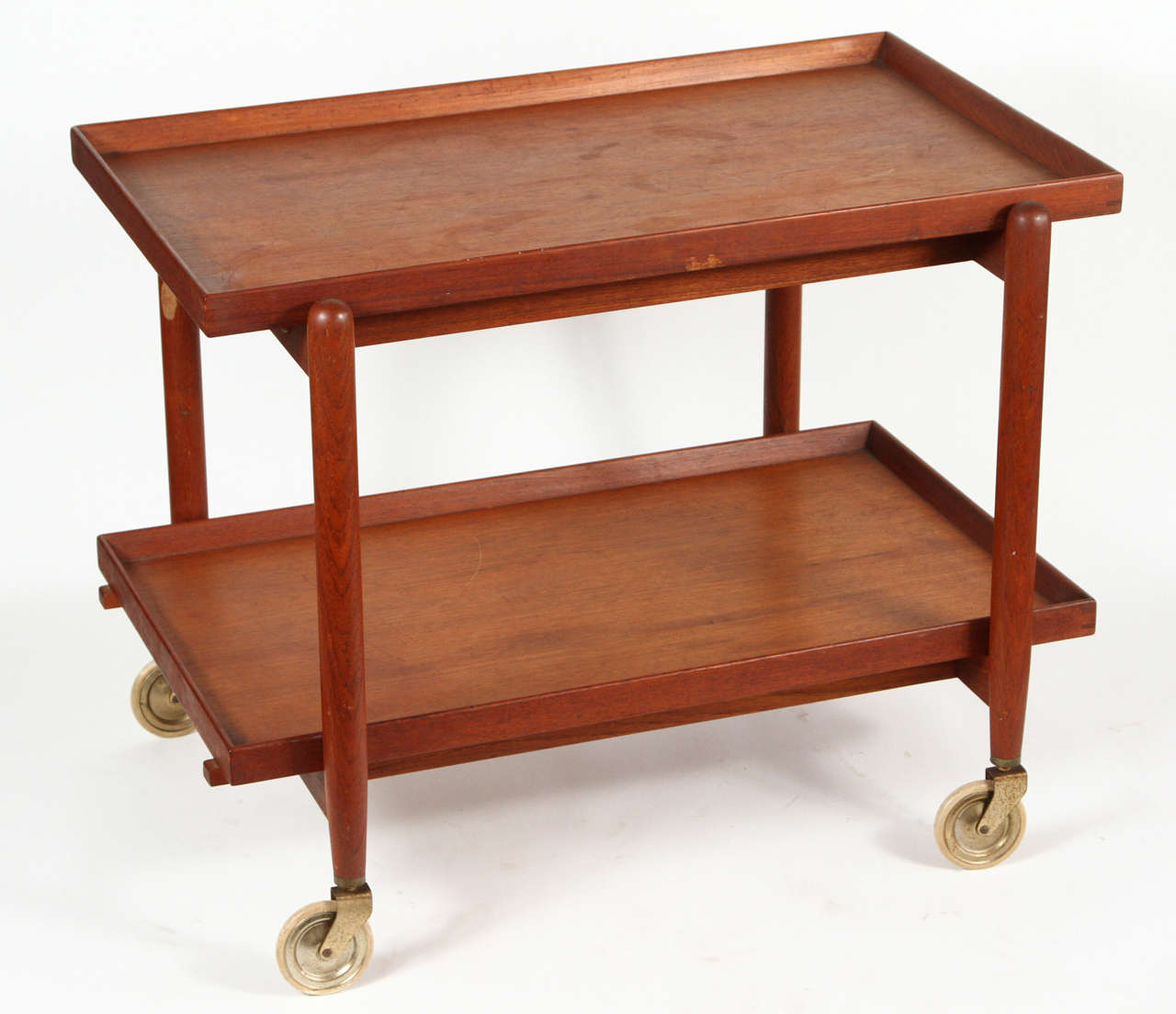 Teak rolling cart by Poul Hundevad. Top opens to accommodate two shelves side by side, doubling as a functional server. Made in Denmark circa 1960s.