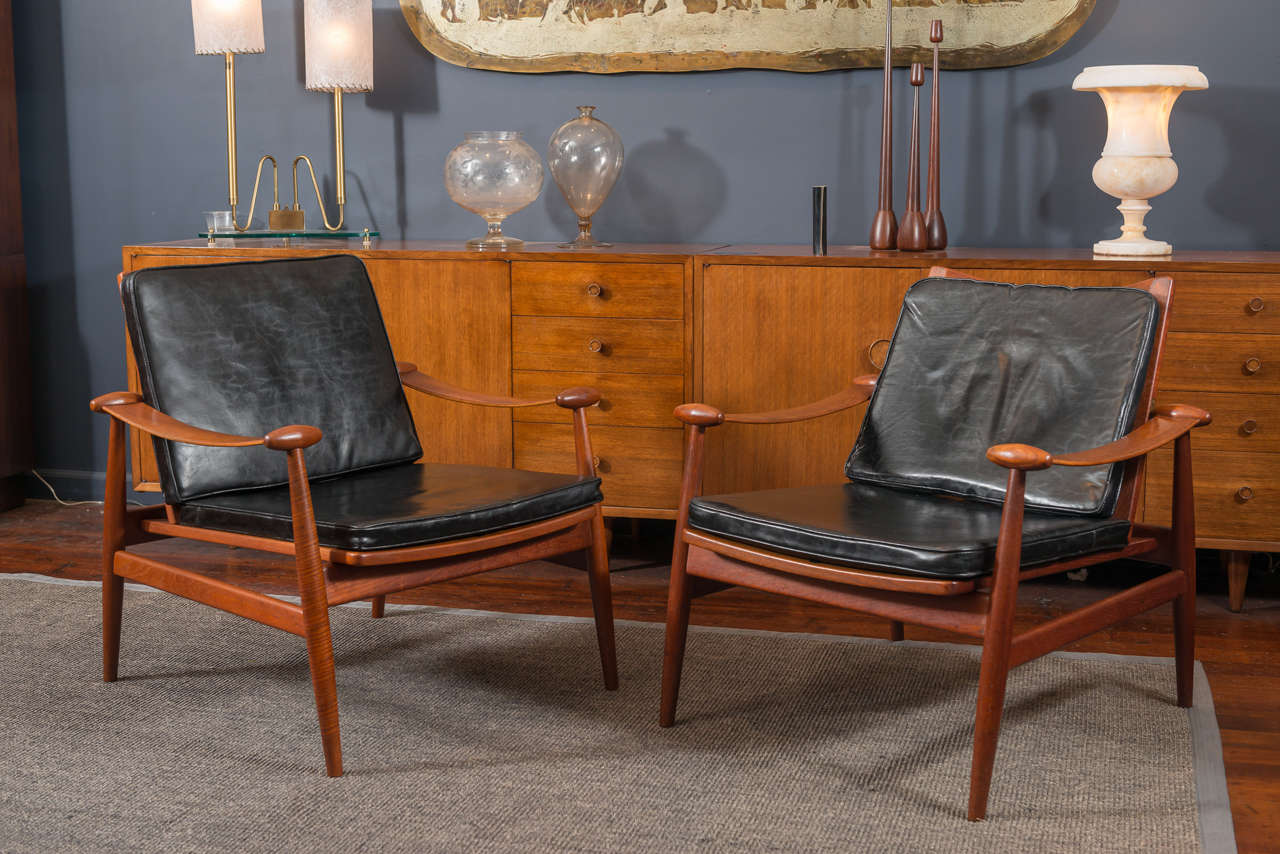 Finn Juhl design model #133 lounge chairs. 
Sculpted frames made from solid teak with original cushions made by FD, Denmark. 
Excellent vintage condition, stamped.
