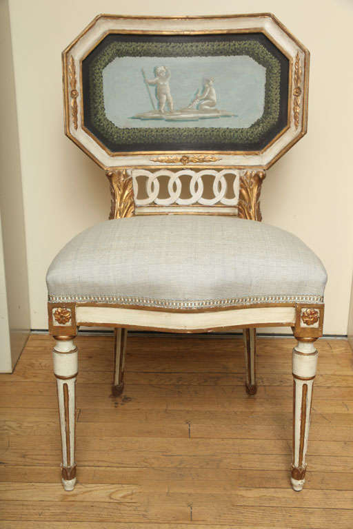 An Italian Neo Classic design side chair with octagonal wooden back decorated putti hand painted en grisaille within laurel wreath, the cream and gilt decorated frame with open fret 