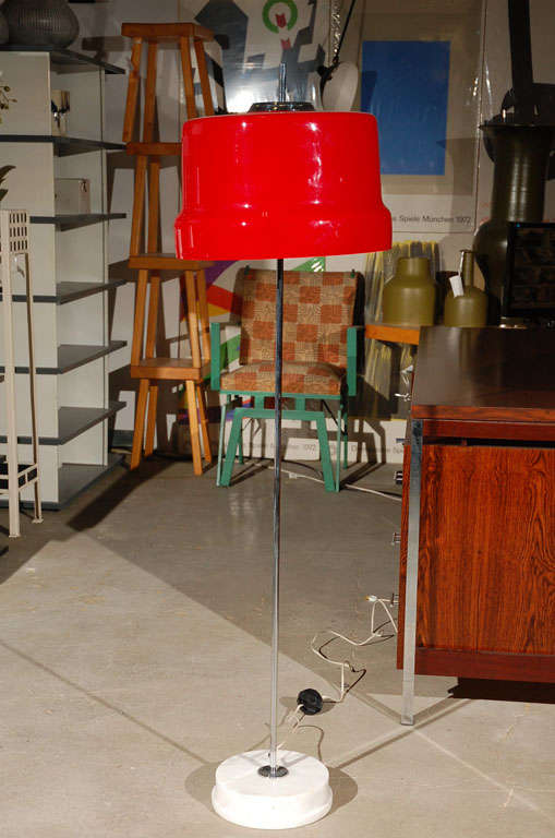 Red cased glass, marble and chromed steel floor lamp.