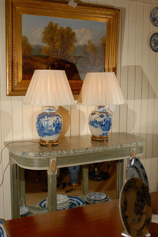 Companion pair of early 19th c. Chinese Blue and White lidded Ginger Jars on custom bases as lamps with silk box pleated shades.