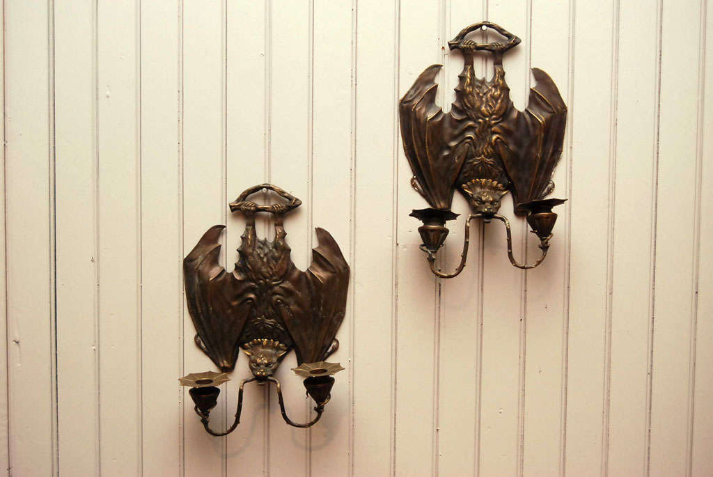 delicately cast sconces in bronze<br />
wonderful detailing<br />
of bats hanging from a branch<br />
with branches sporting candle cup and bobeche<br />
from clenched teeth<br />
numbers etched into back edge