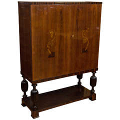A Tall Art Deco Cabinet