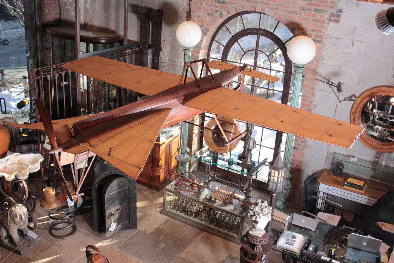 French, c. 1900 this uniquely hand-crafted model airplane is extremely impressive in scale measuring 9 feet long.  It may have been built by early avitation pioneer Louis Bleriot, or by his collaborator Gabriel Voisin, with whom he created many