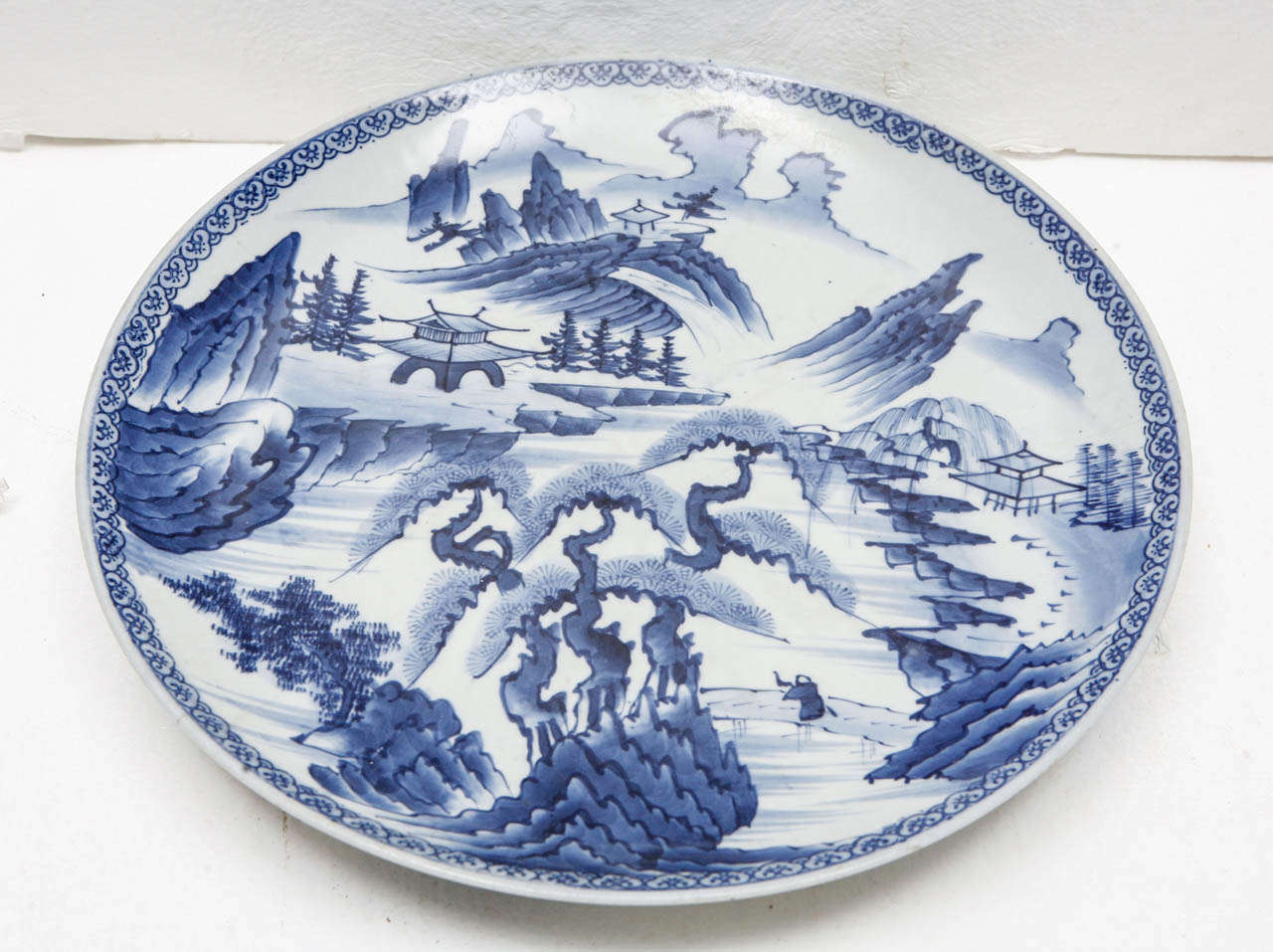Vintage blue & white hand painted charger with landscape of mountains, trees, houses and clouds.
Perfect, no cracks or chips.