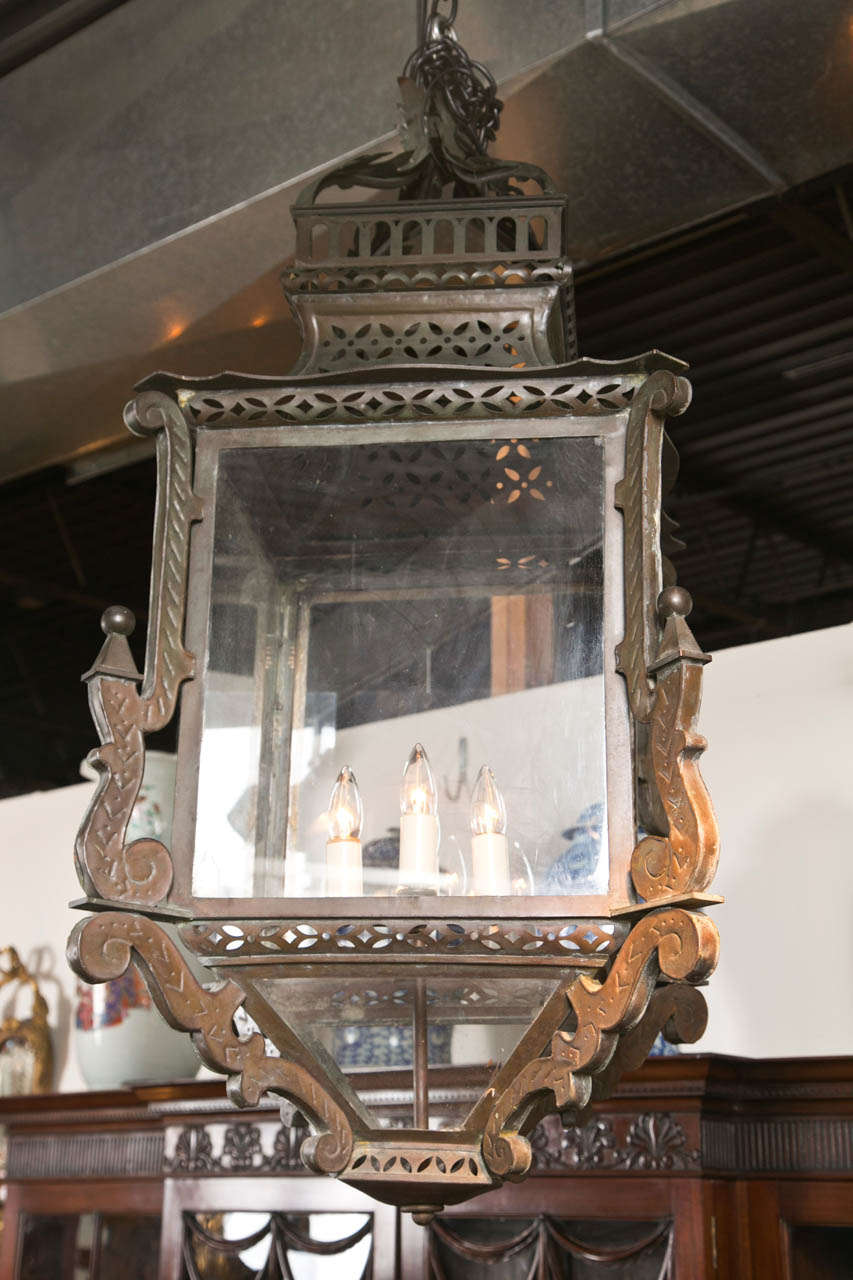 A Continental four light bronze lantern with copper ornamentation.