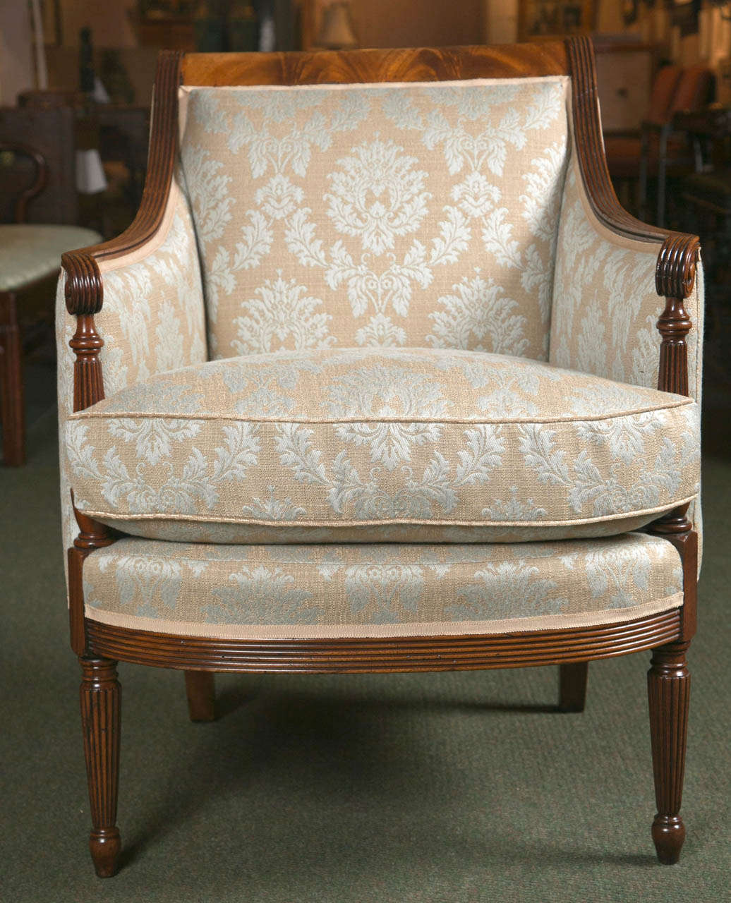 A newly upholstered English mahogany tub chair in excellent condition.